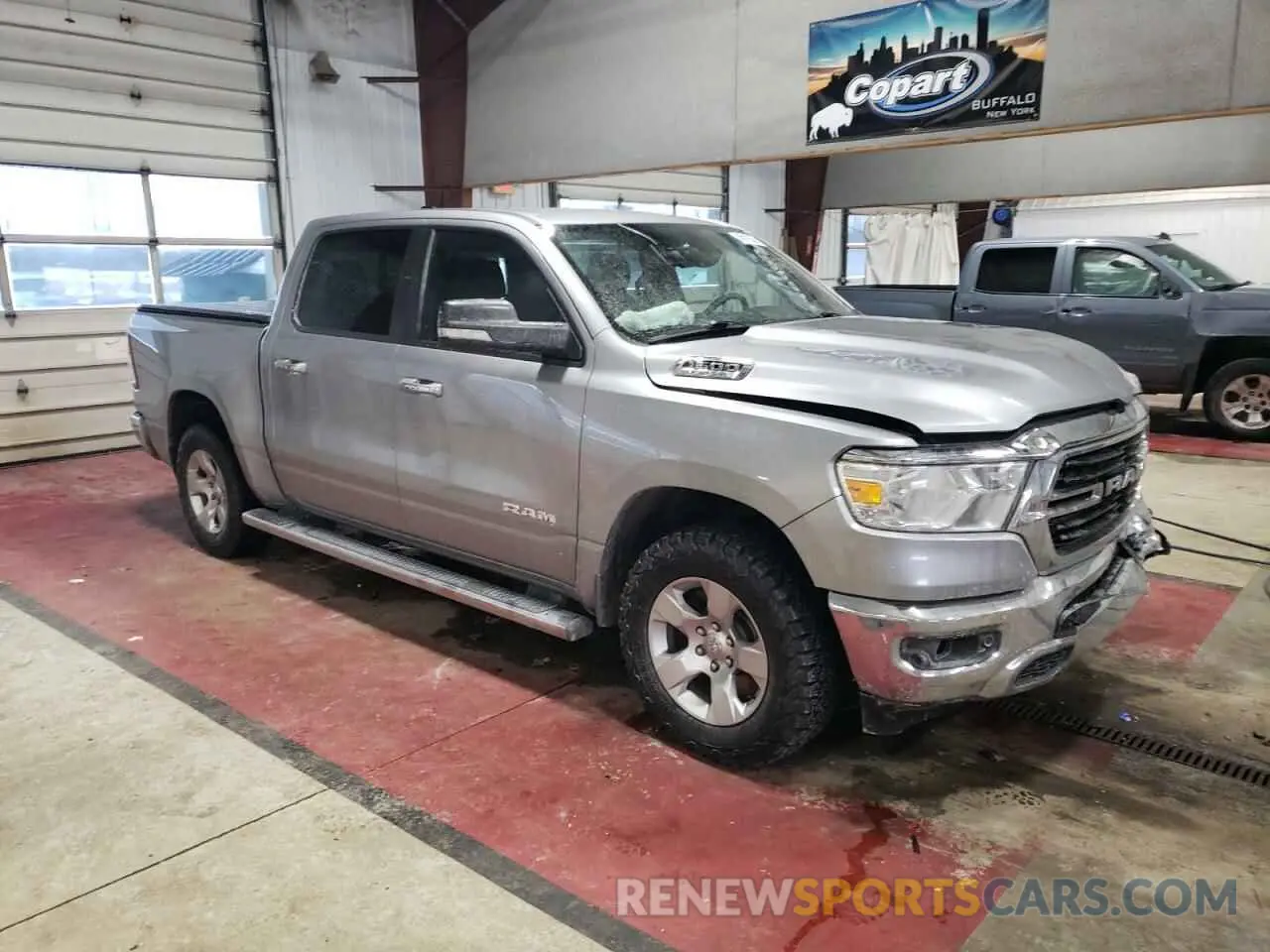 4 Photograph of a damaged car 1C6SRFFTXKN734516 RAM 1500 2019