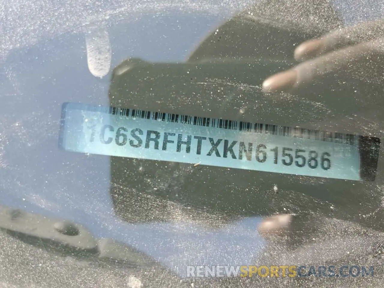 12 Photograph of a damaged car 1C6SRFHTXKN615586 RAM 1500 2019