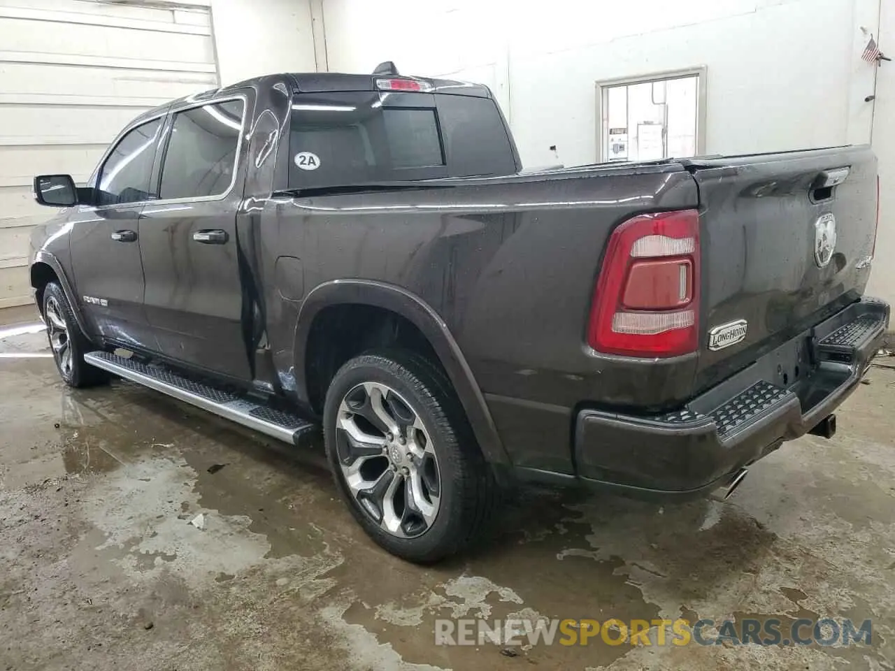 2 Photograph of a damaged car 1C6SRFKT3KN778279 RAM 1500 2019