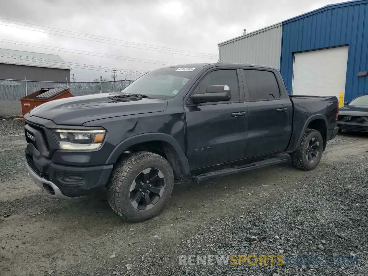 1 Photograph of a damaged car 1C6SRFLT1KN582579 RAM 1500 2019