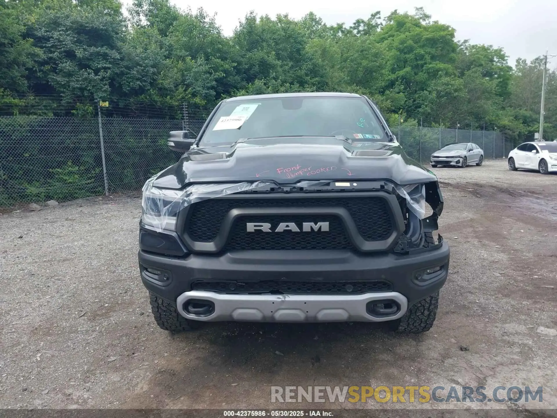 13 Photograph of a damaged car 1C6SRFLT1KN784936 RAM 1500 2019