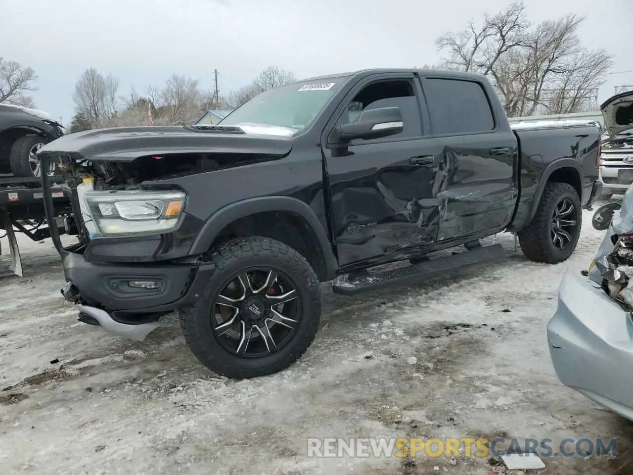 1 Photograph of a damaged car 1C6SRFLT1KN915220 RAM 1500 2019