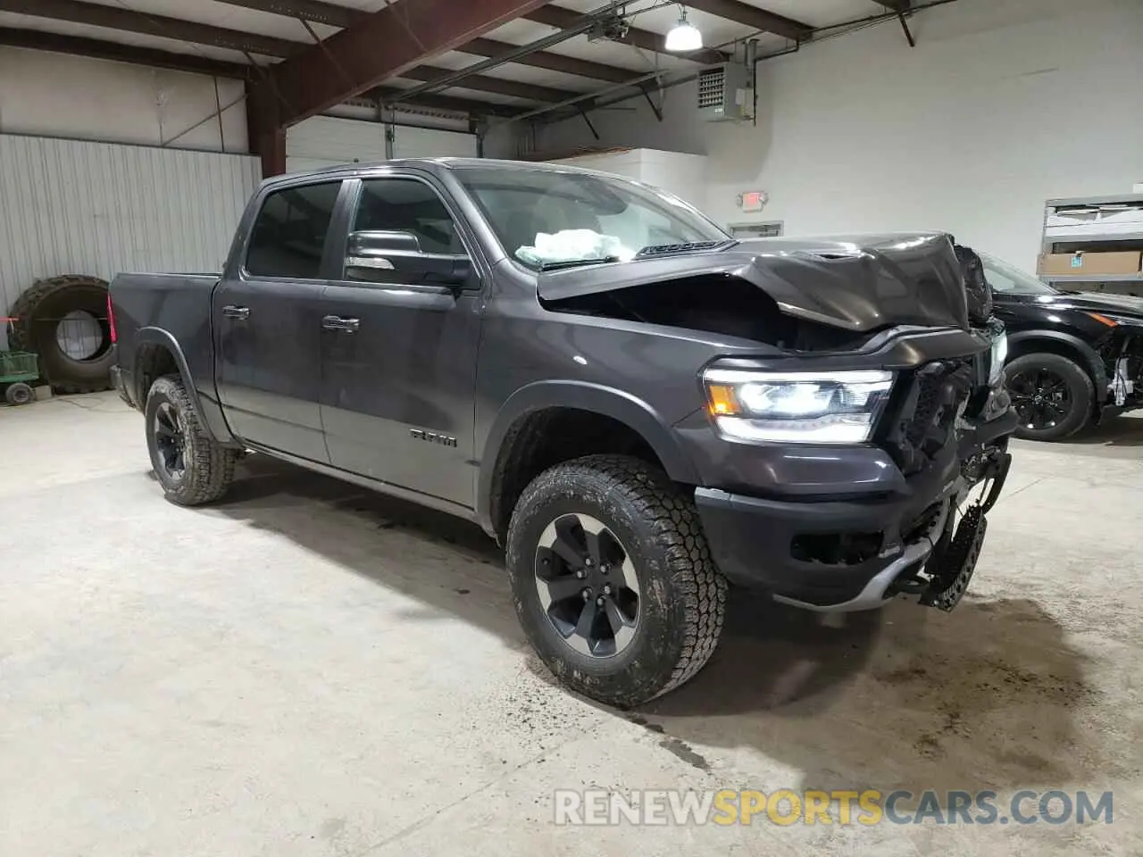 4 Photograph of a damaged car 1C6SRFLT4KN874338 RAM 1500 2019