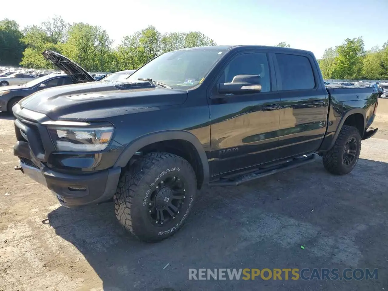 1 Photograph of a damaged car 1C6SRFLT5KN811457 RAM 1500 2019