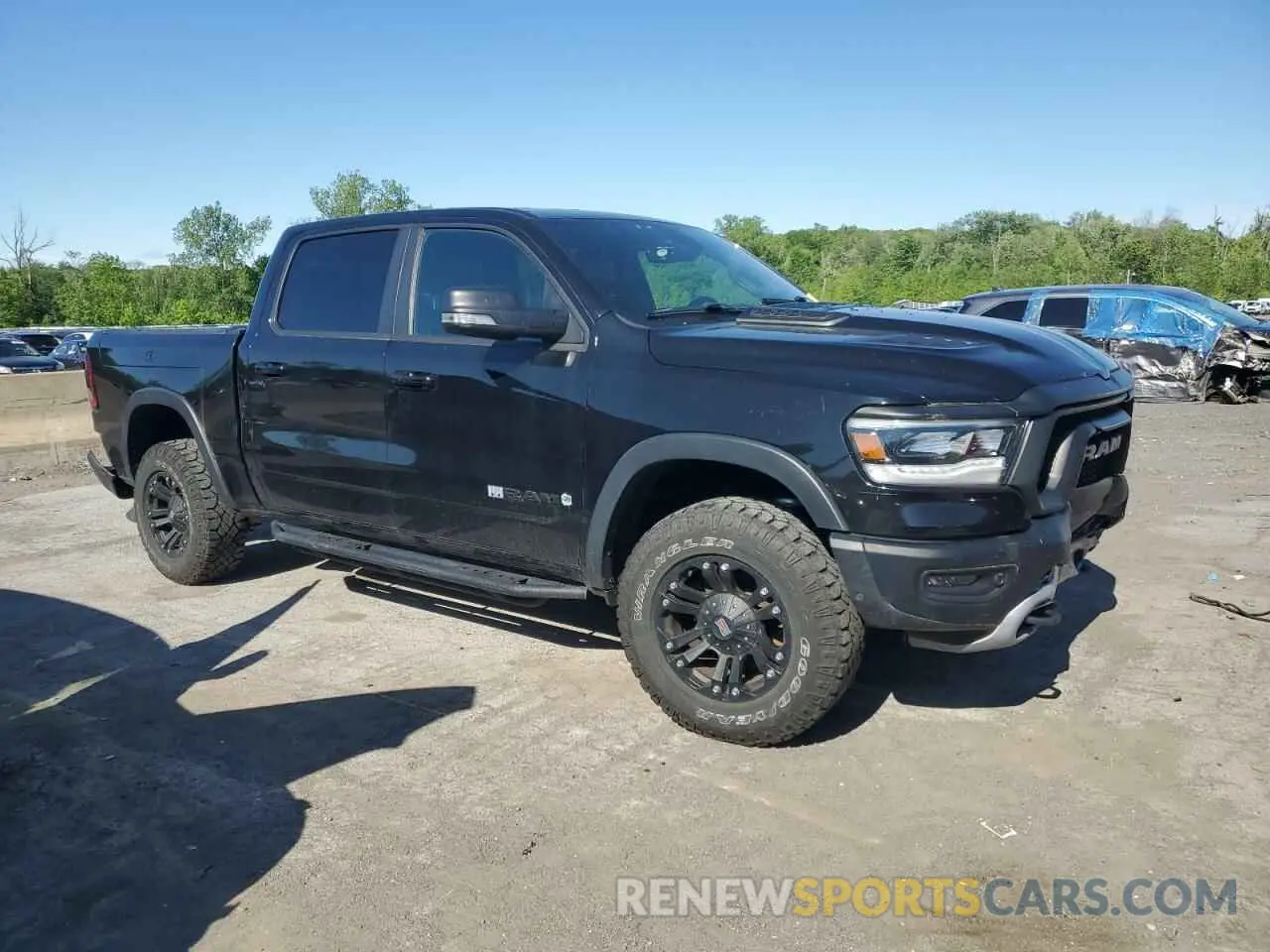 4 Photograph of a damaged car 1C6SRFLT5KN811457 RAM 1500 2019