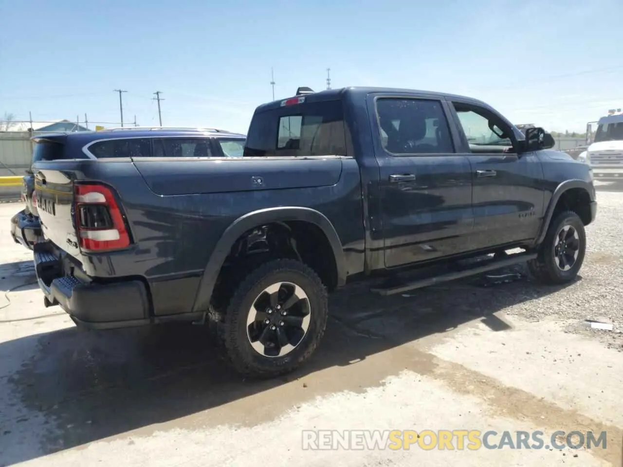 3 Photograph of a damaged car 1C6SRFLT6KN615351 RAM 1500 2019
