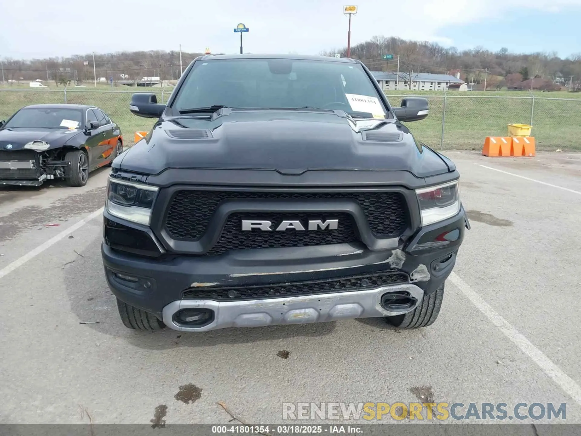 12 Photograph of a damaged car 1C6SRFLT9KN690335 RAM 1500 2019