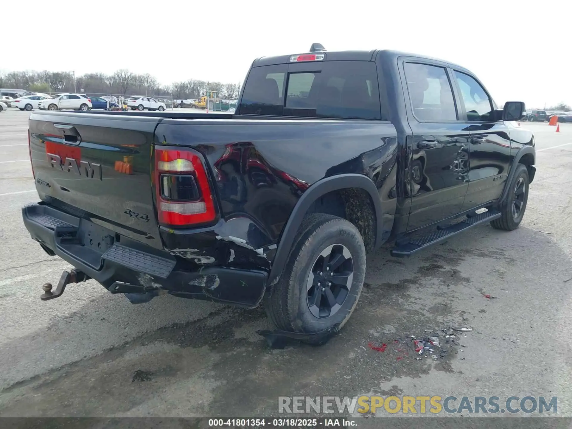 4 Photograph of a damaged car 1C6SRFLT9KN690335 RAM 1500 2019