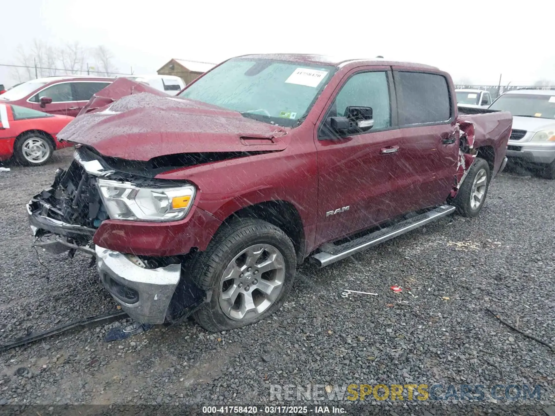 2 Photograph of a damaged car 1C6SRFMT2KN577034 RAM 1500 2019