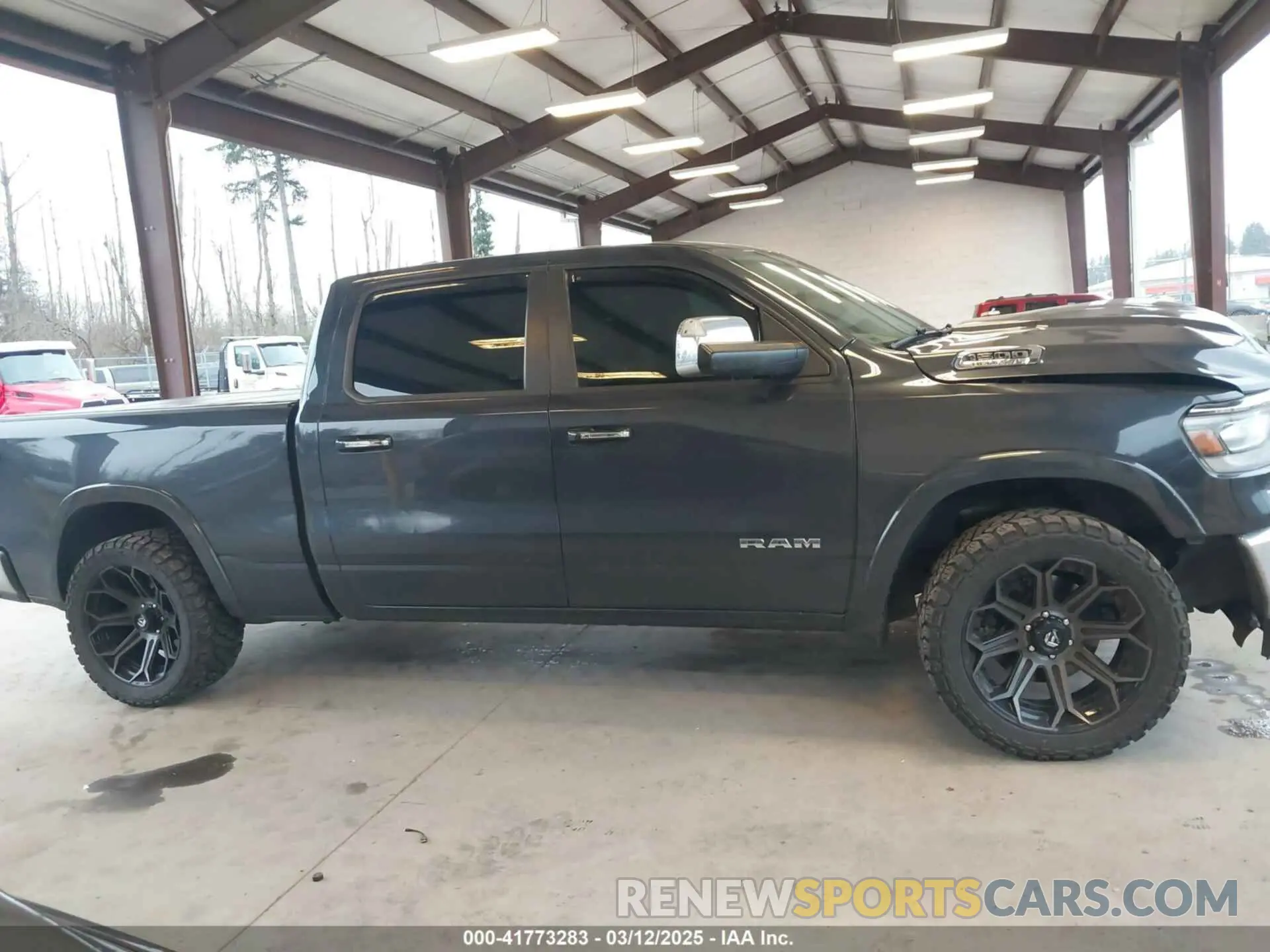13 Photograph of a damaged car 1C6SRFRT9KN878862 RAM 1500 2019