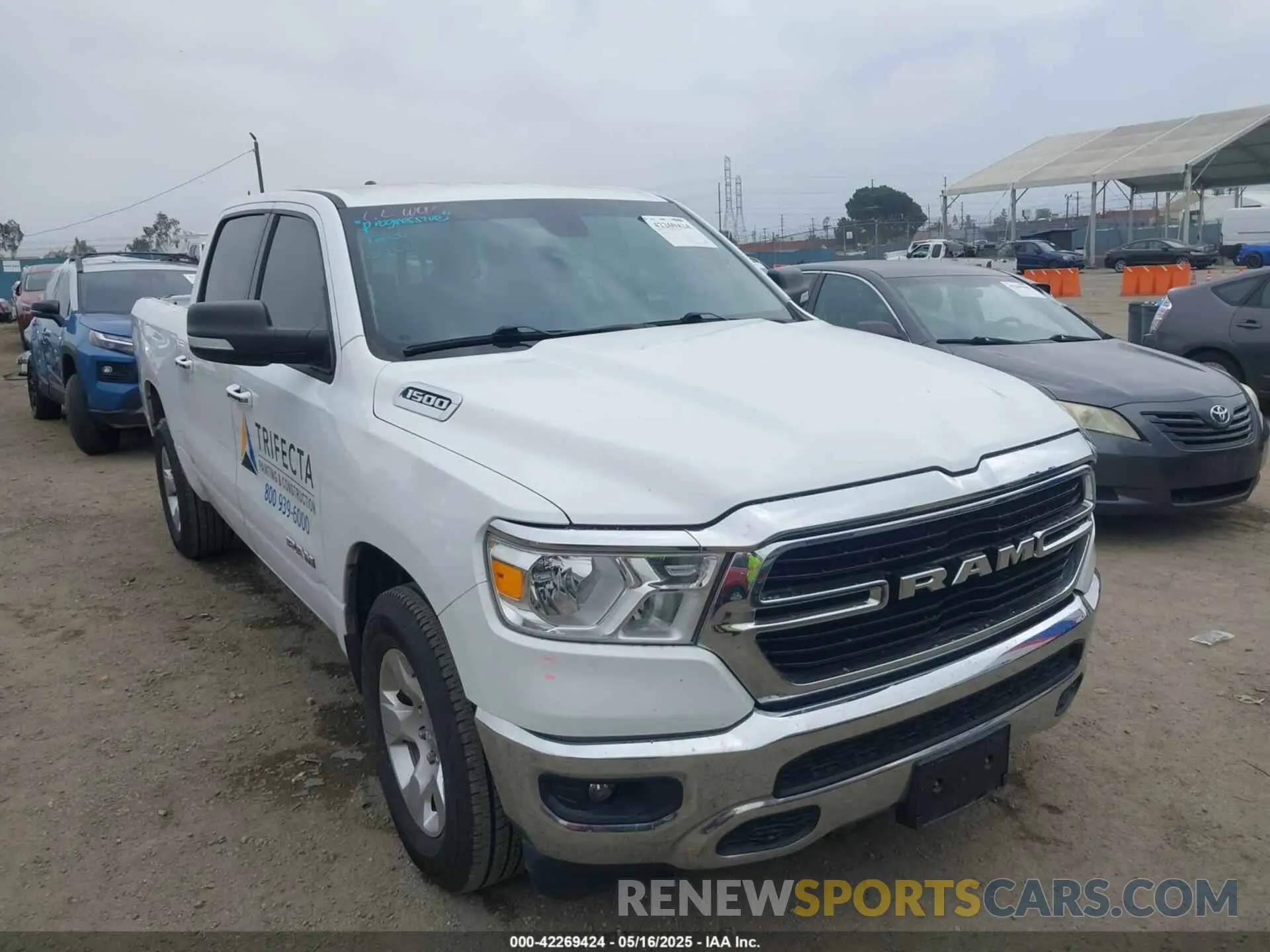 1 Photograph of a damaged car 1C6RREFG3LN129718 RAM 1500 2020