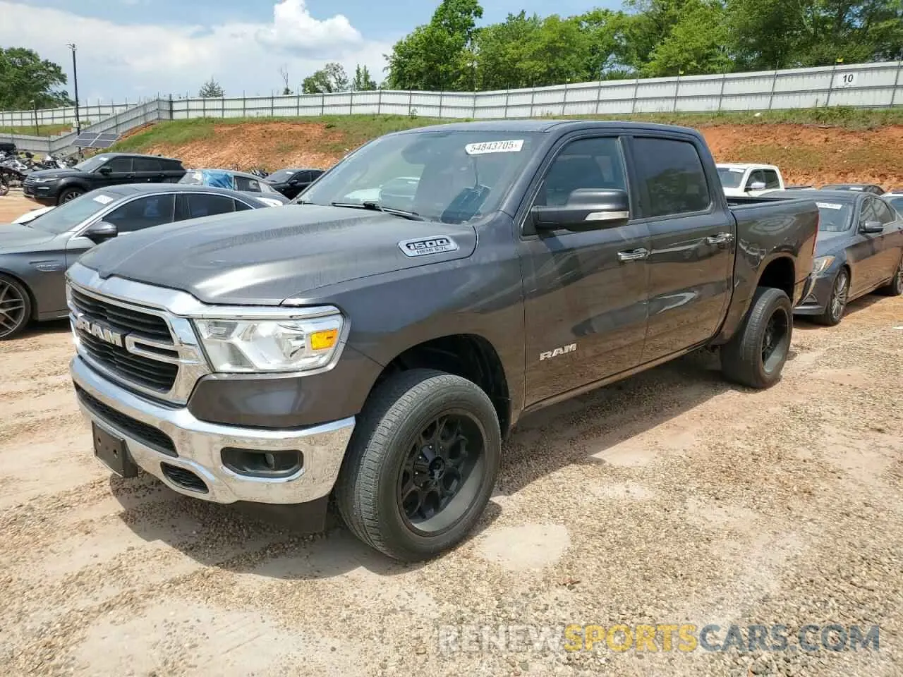 1 Photograph of a damaged car 1C6RREFT0LN406628 RAM 1500 2020