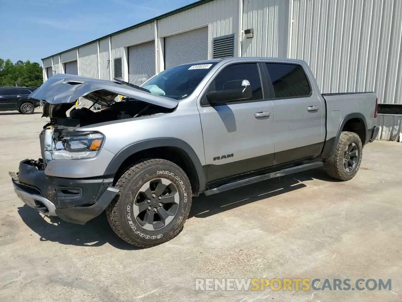 1 Photograph of a damaged car 1C6RRELT0LN303553 RAM 1500 2020