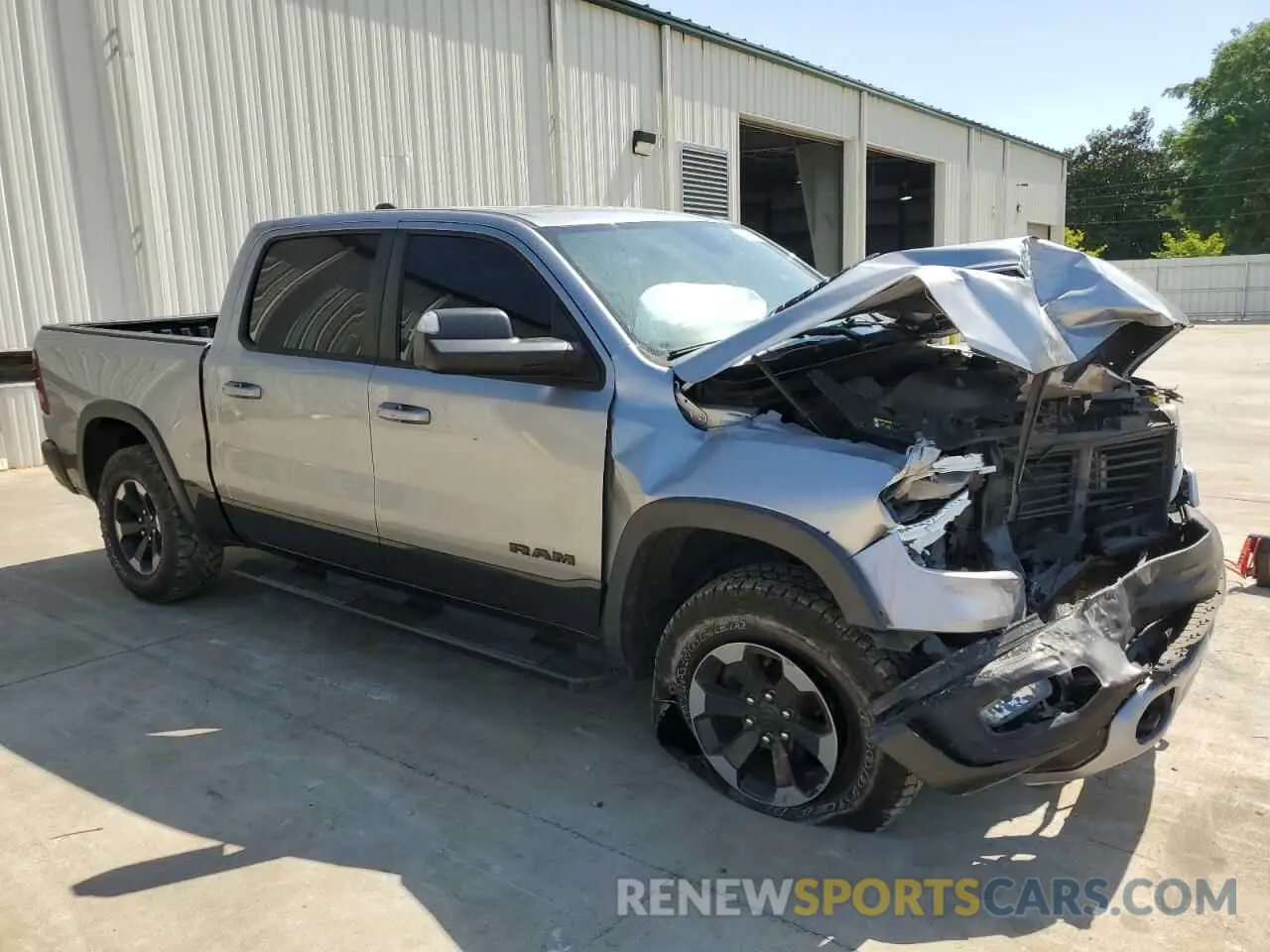 4 Photograph of a damaged car 1C6RRELT0LN303553 RAM 1500 2020