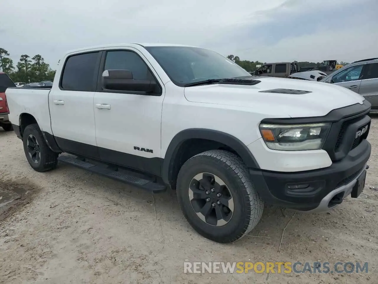 4 Photograph of a damaged car 1C6RRELT2LN303523 RAM 1500 2020