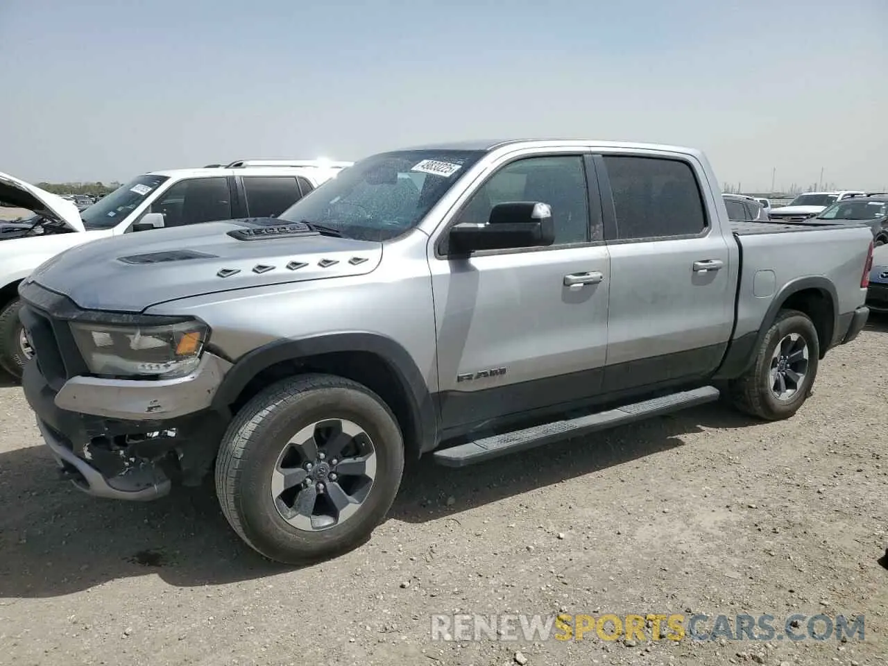 1 Photograph of a damaged car 1C6RRELT8LN303588 RAM 1500 2020