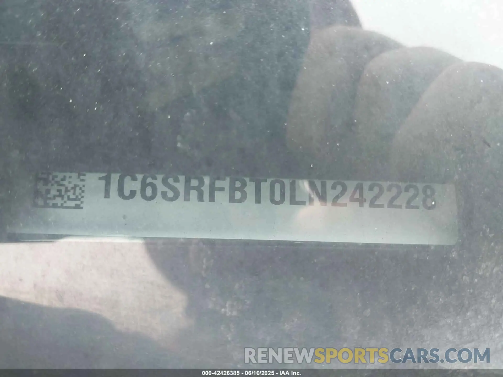 9 Photograph of a damaged car 1C6SRFBT0LN242228 RAM 1500 2020