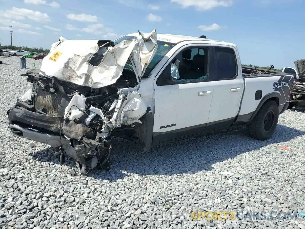 1 Photograph of a damaged car 1C6SRFET9LN258178 RAM 1500 2020