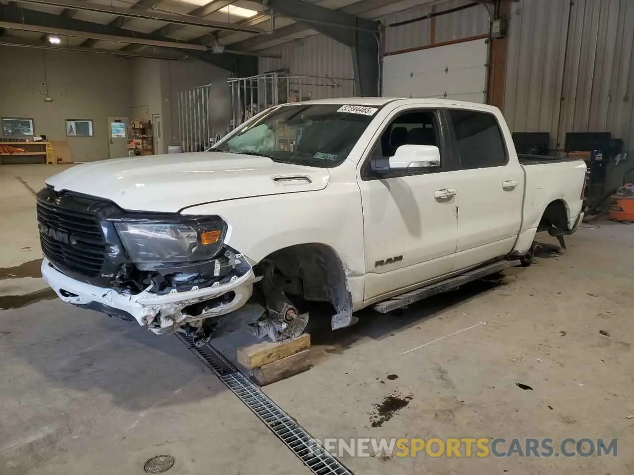 1 Photograph of a damaged car 1C6SRFFT0LN313955 RAM 1500 2020
