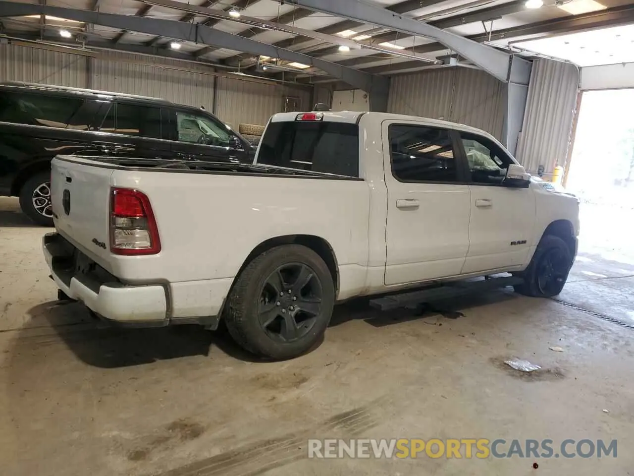 3 Photograph of a damaged car 1C6SRFFT0LN313955 RAM 1500 2020