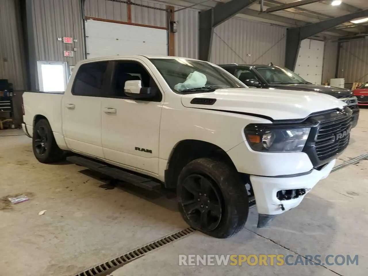 4 Photograph of a damaged car 1C6SRFFT0LN313955 RAM 1500 2020