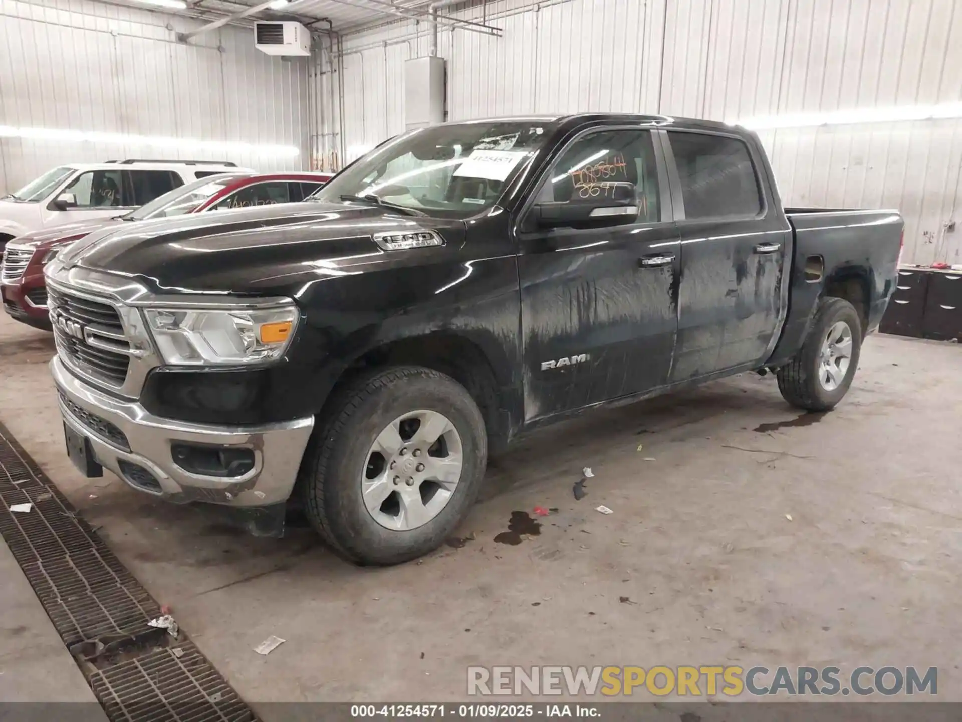 2 Photograph of a damaged car 1C6SRFFT1LN185452 RAM 1500 2020