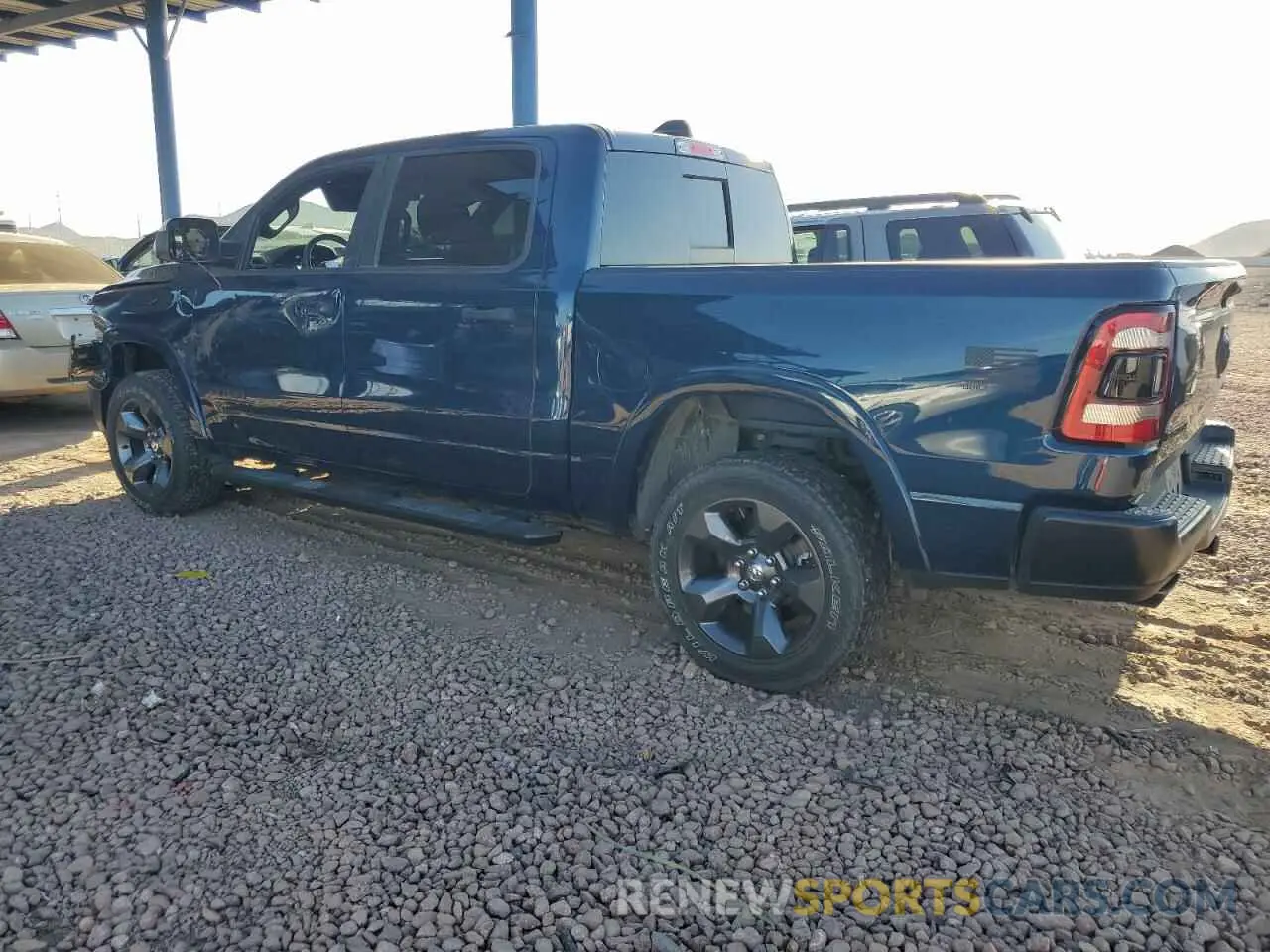 2 Photograph of a damaged car 1C6SRFFT3LN410700 RAM 1500 2020