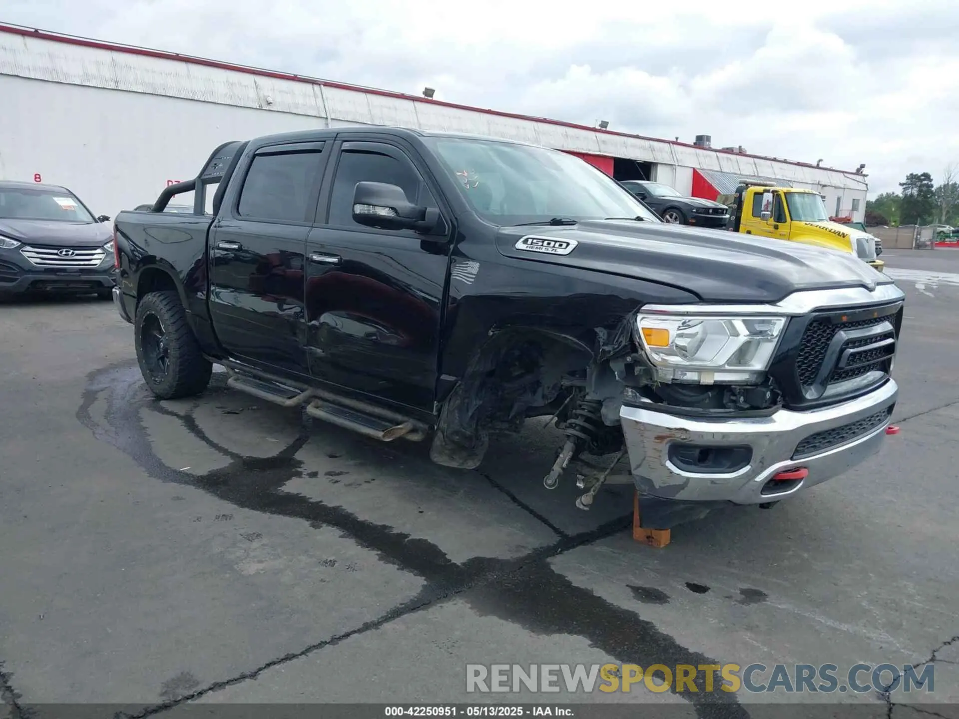 1 Photograph of a damaged car 1C6SRFFT5LN113394 RAM 1500 2020