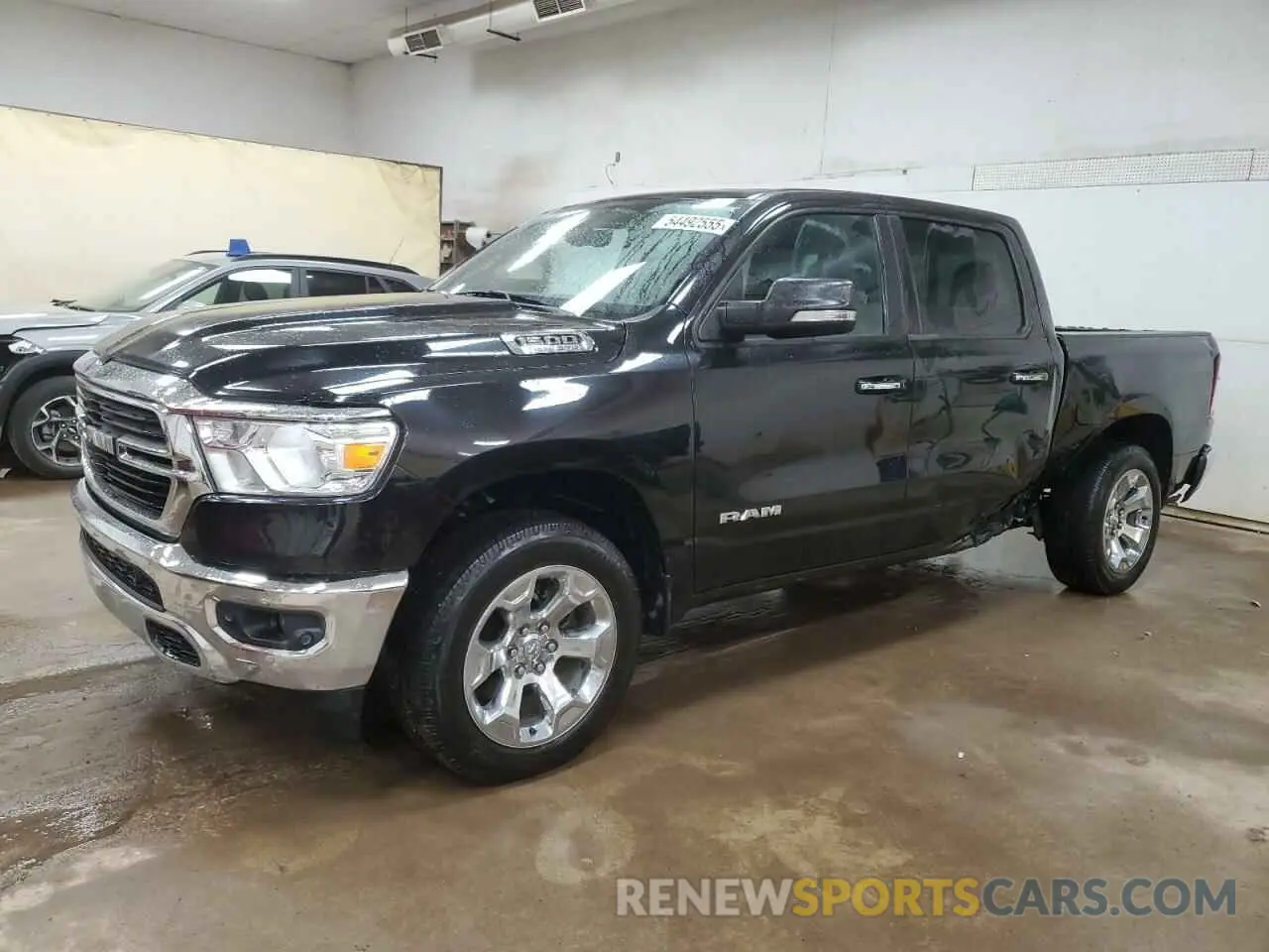 1 Photograph of a damaged car 1C6SRFFT6LN327102 RAM 1500 2020