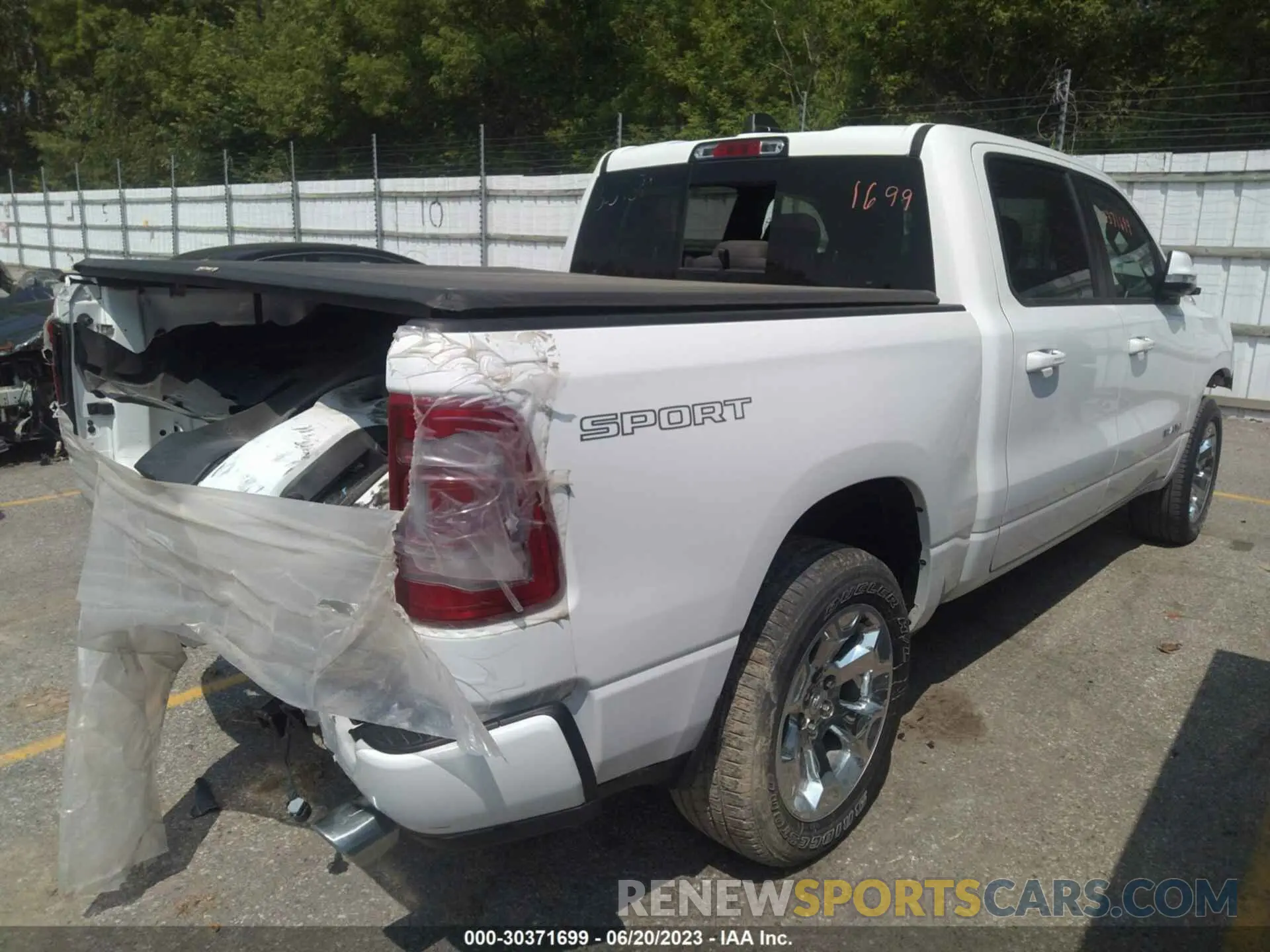 4 Photograph of a damaged car 1C6SRFFT7LN108696 RAM 1500 2020