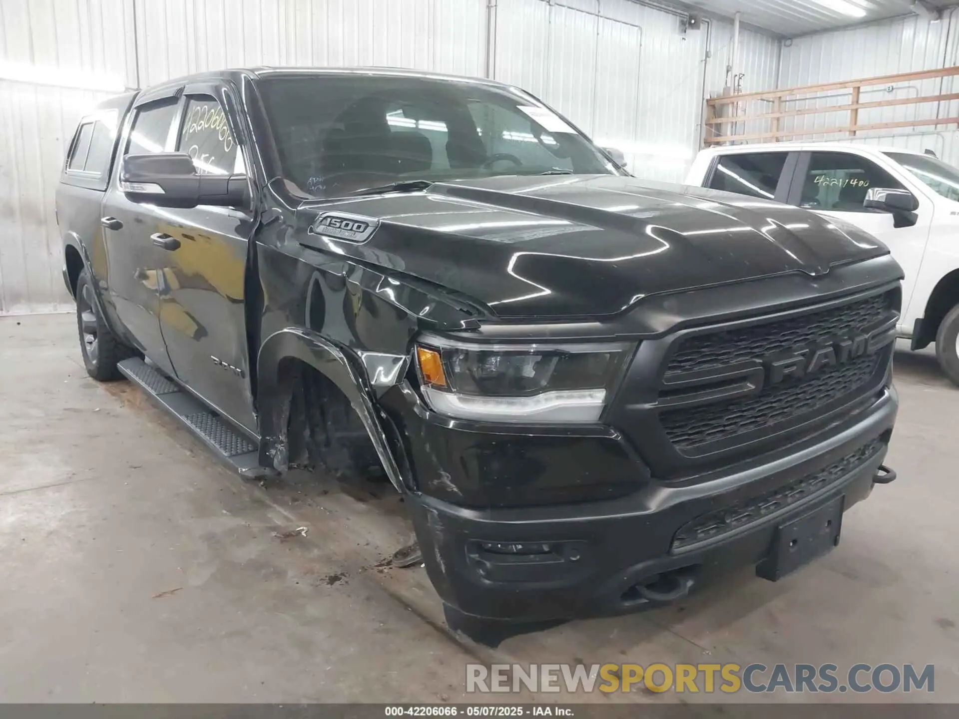 1 Photograph of a damaged car 1C6SRFFT8LN308129 RAM 1500 2020