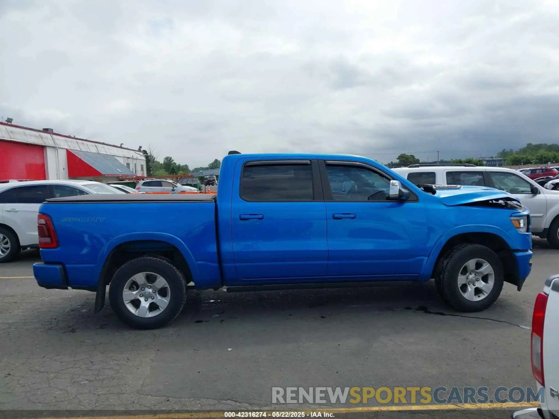 13 Photograph of a damaged car 1C6SRFJM8LN343494 RAM 1500 2020