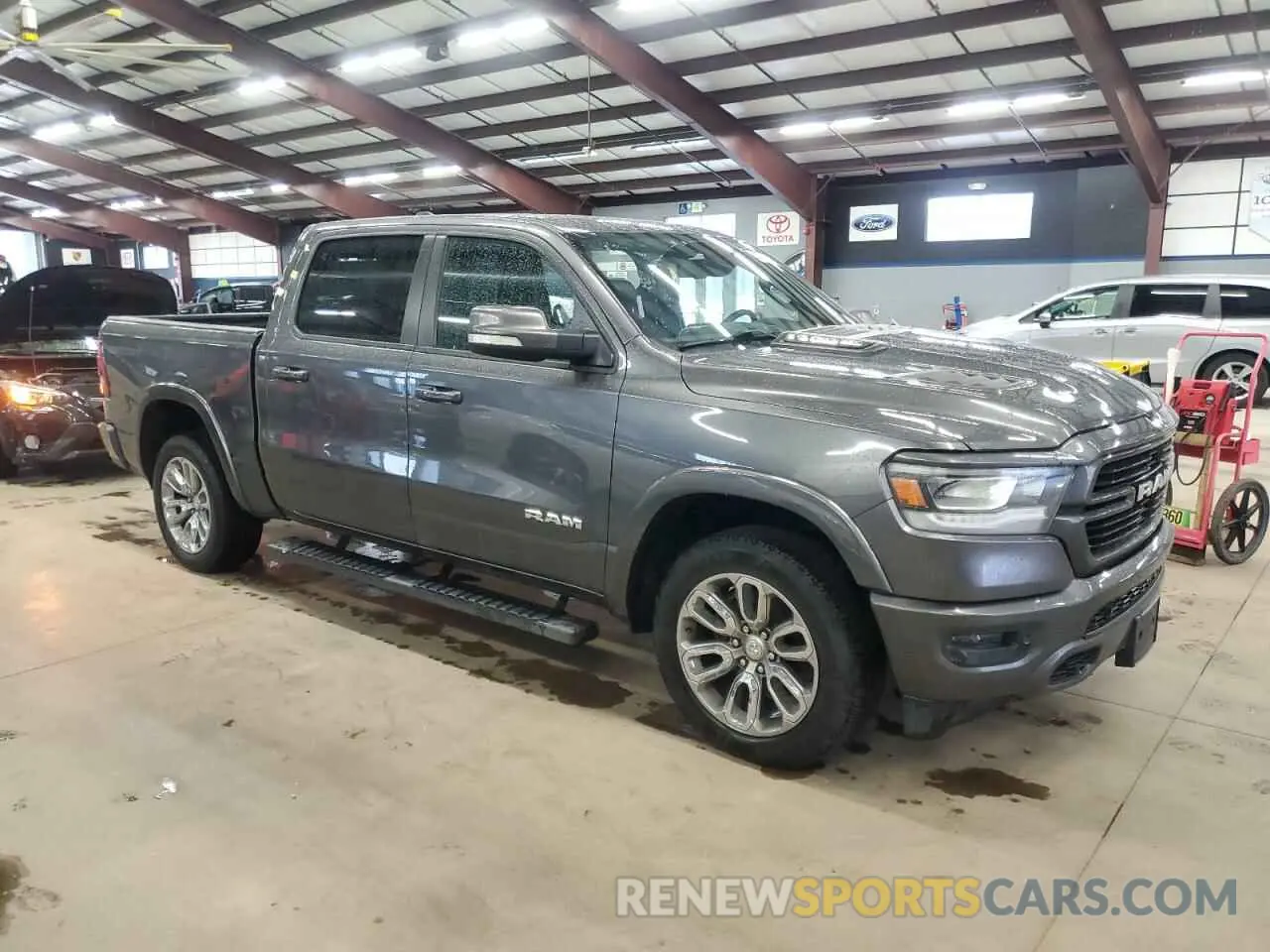 4 Photograph of a damaged car 1C6SRFJT4LN324870 RAM 1500 2020