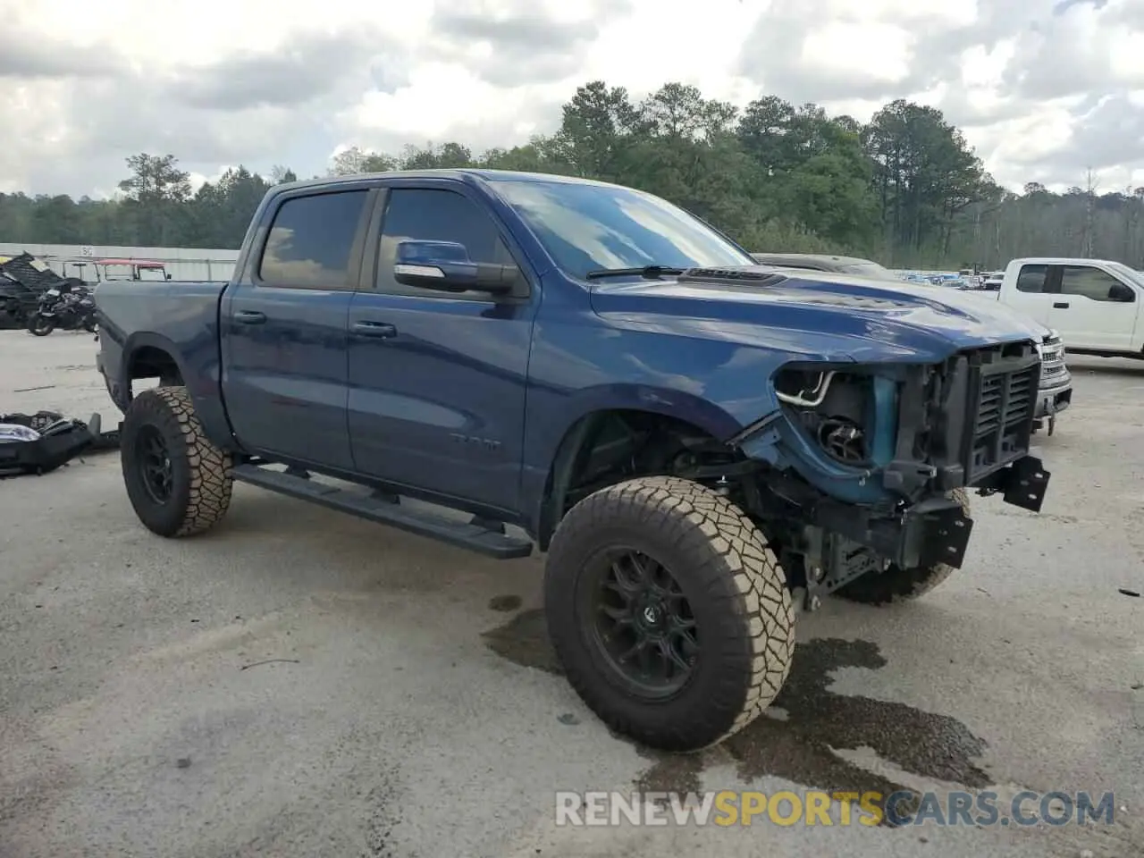 4 Photograph of a damaged car 1C6SRFLT0LN112884 RAM 1500 2020