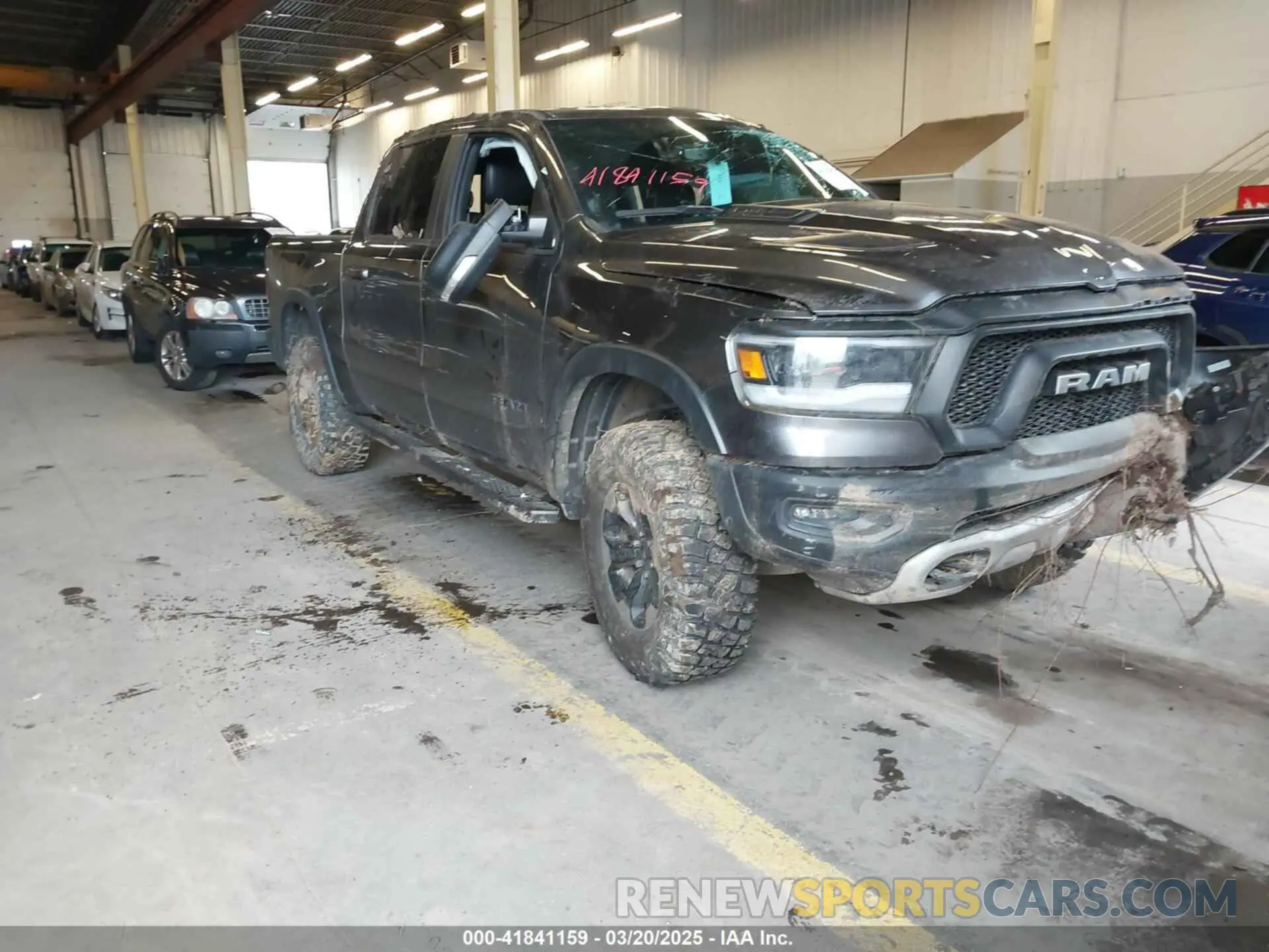 1 Photograph of a damaged car 1C6SRFLT0LN162491 RAM 1500 2020
