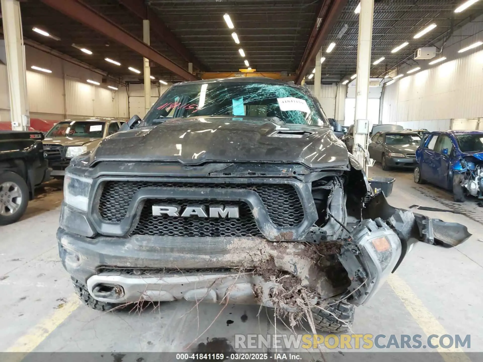 13 Photograph of a damaged car 1C6SRFLT0LN162491 RAM 1500 2020
