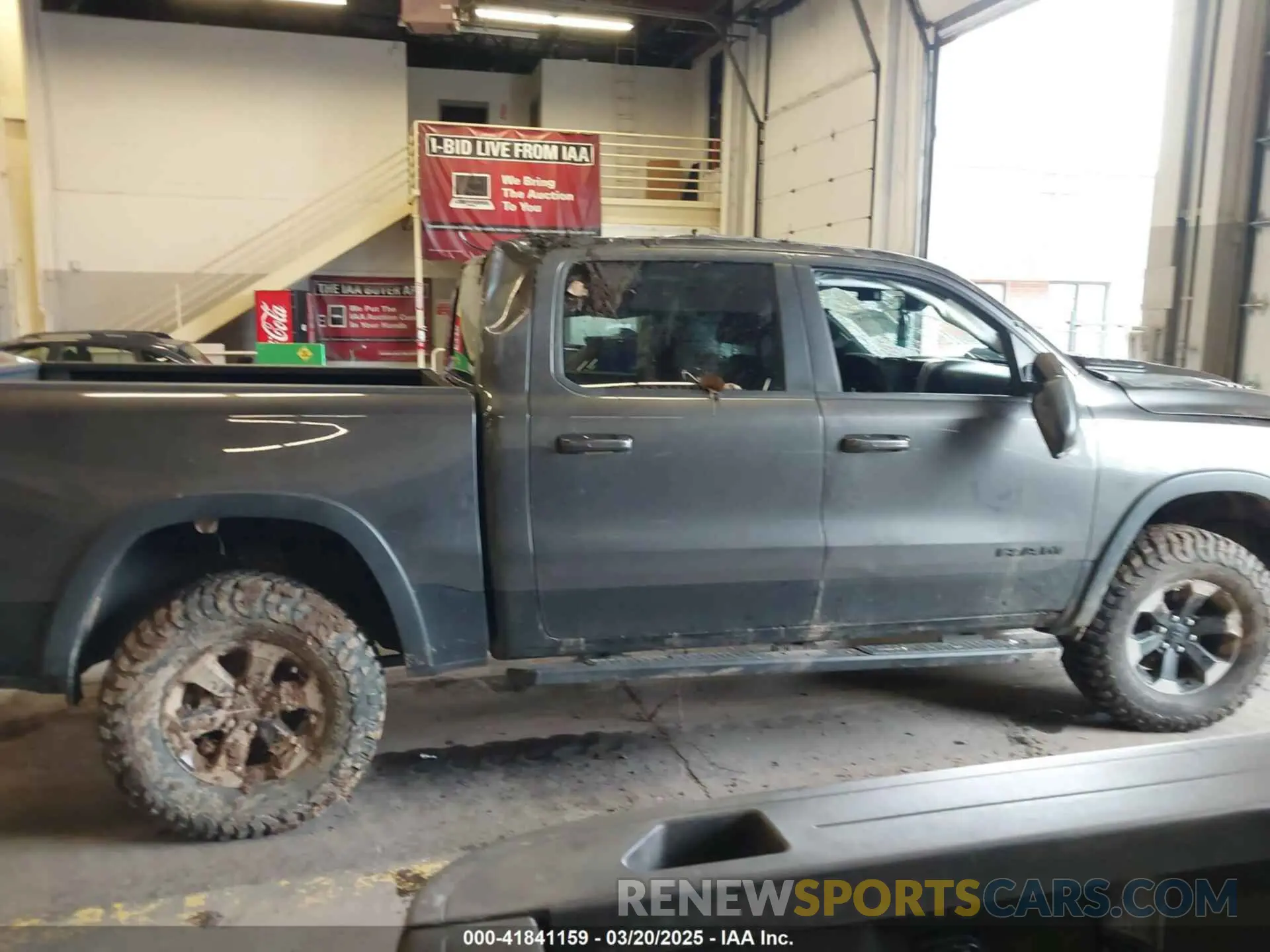 14 Photograph of a damaged car 1C6SRFLT0LN162491 RAM 1500 2020