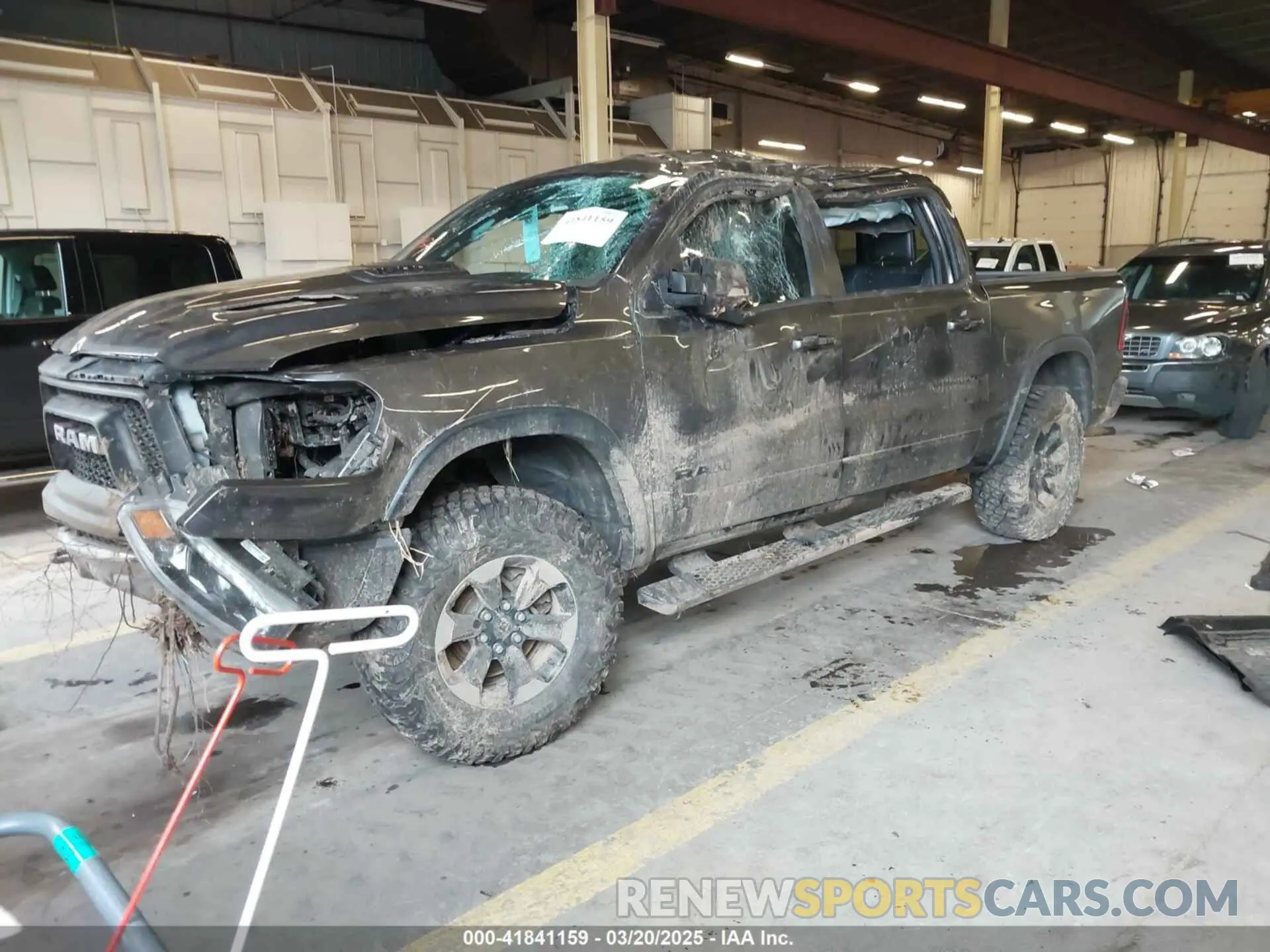 2 Photograph of a damaged car 1C6SRFLT0LN162491 RAM 1500 2020