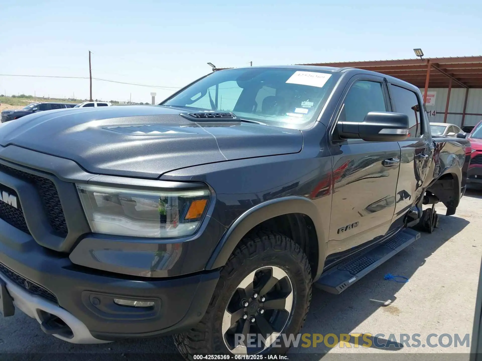15 Photograph of a damaged car 1C6SRFLT1LN398728 RAM 1500 2020