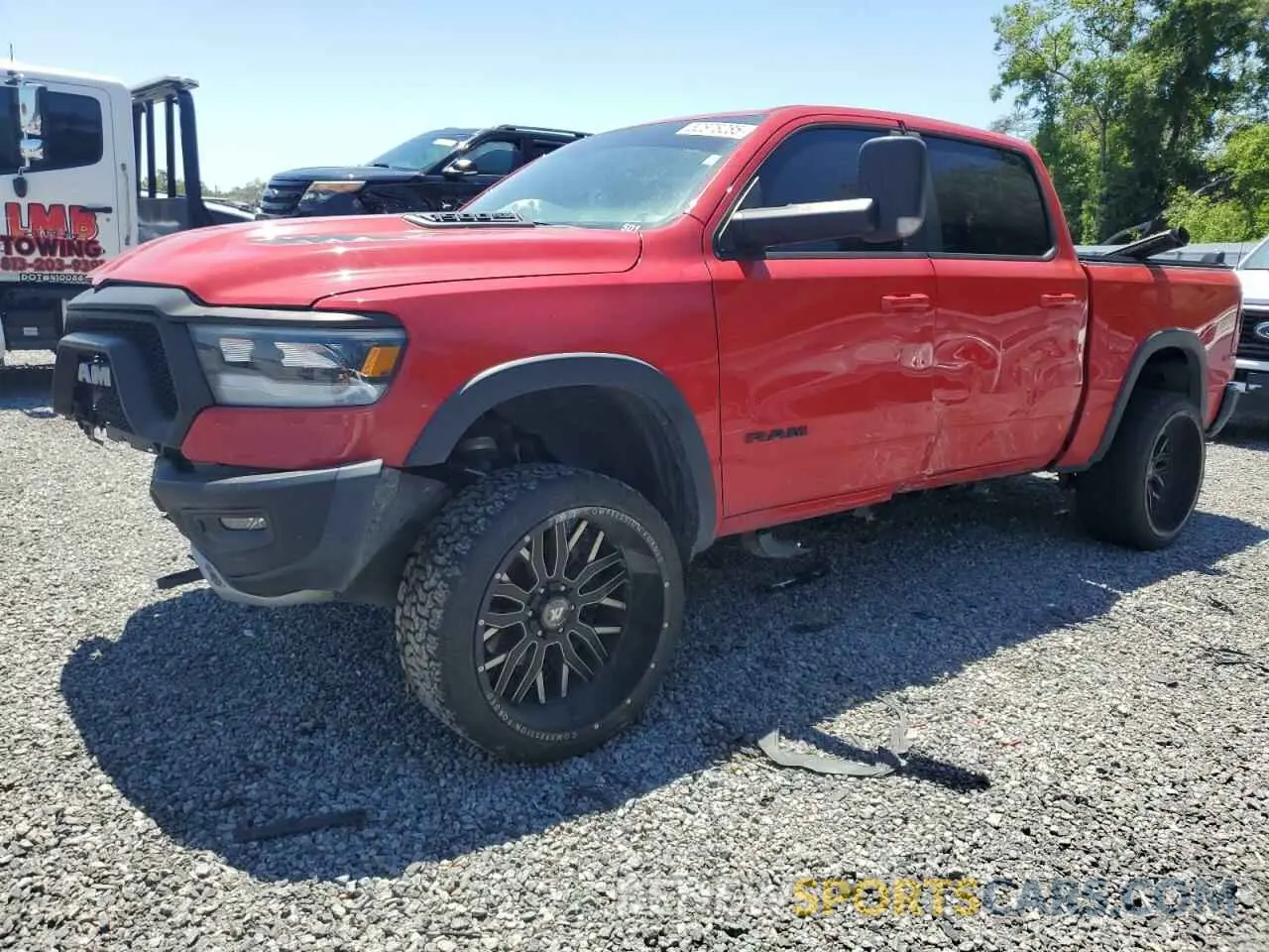 1 Photograph of a damaged car 1C6SRFLT2LN329658 RAM 1500 2020