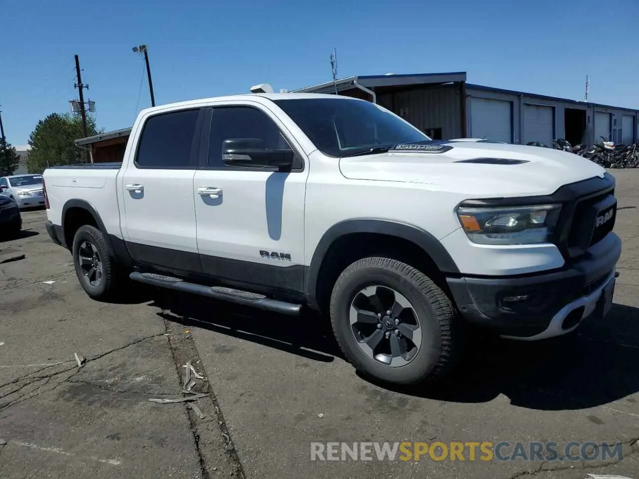 4 Photograph of a damaged car 1C6SRFLT2LN360456 RAM 1500 2020