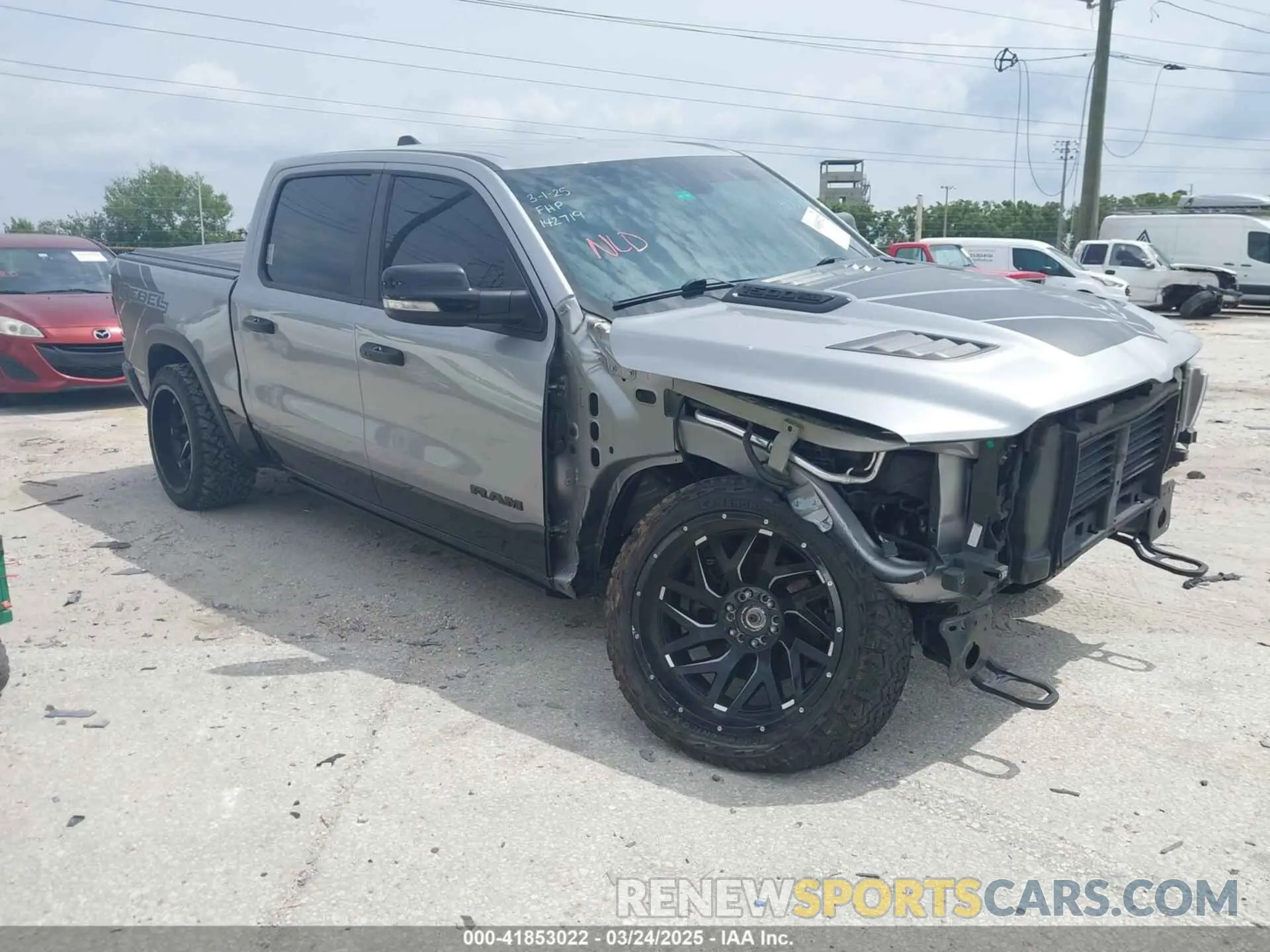 1 Photograph of a damaged car 1C6SRFLT3LN142719 RAM 1500 2020