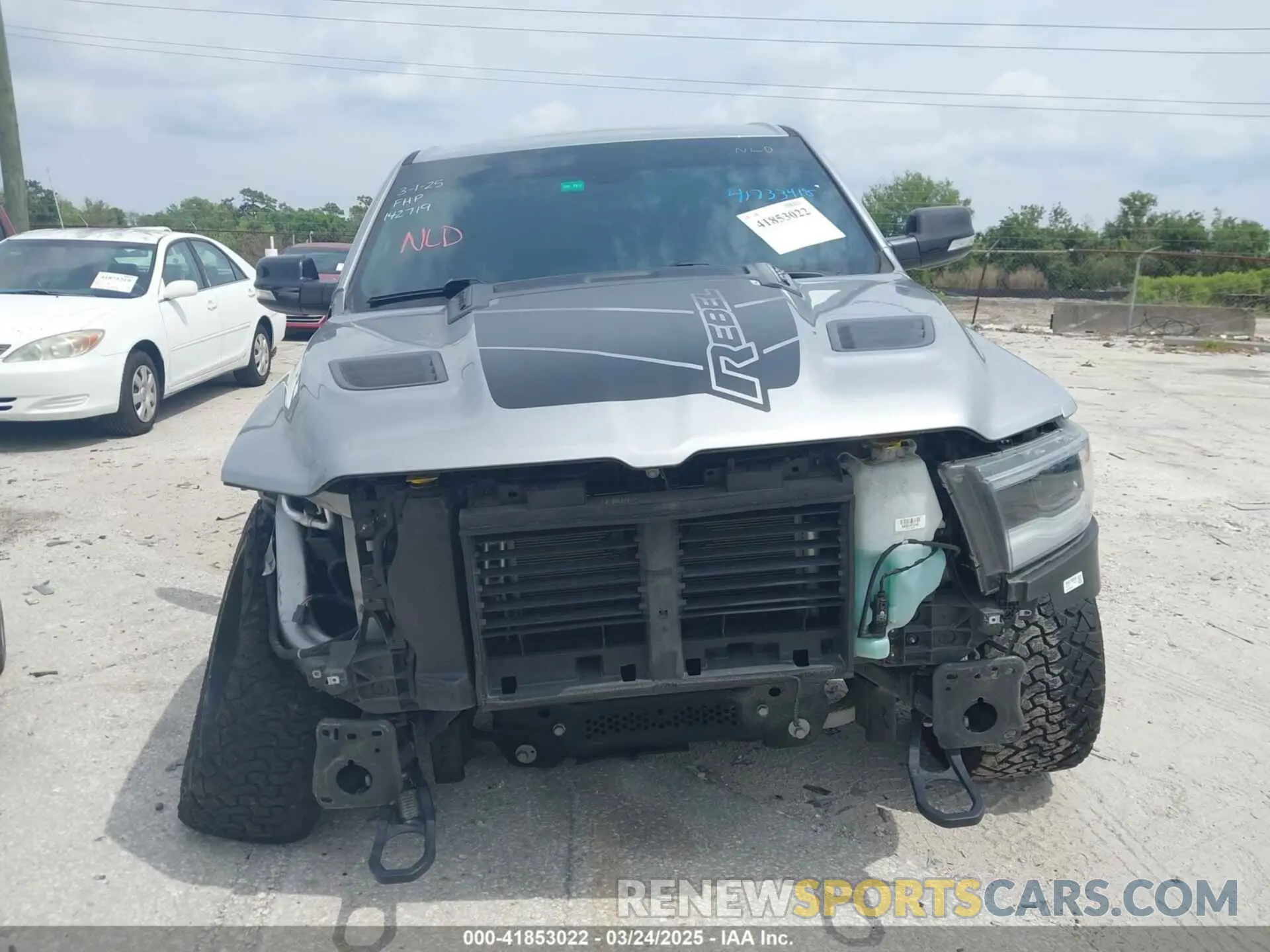 13 Photograph of a damaged car 1C6SRFLT3LN142719 RAM 1500 2020