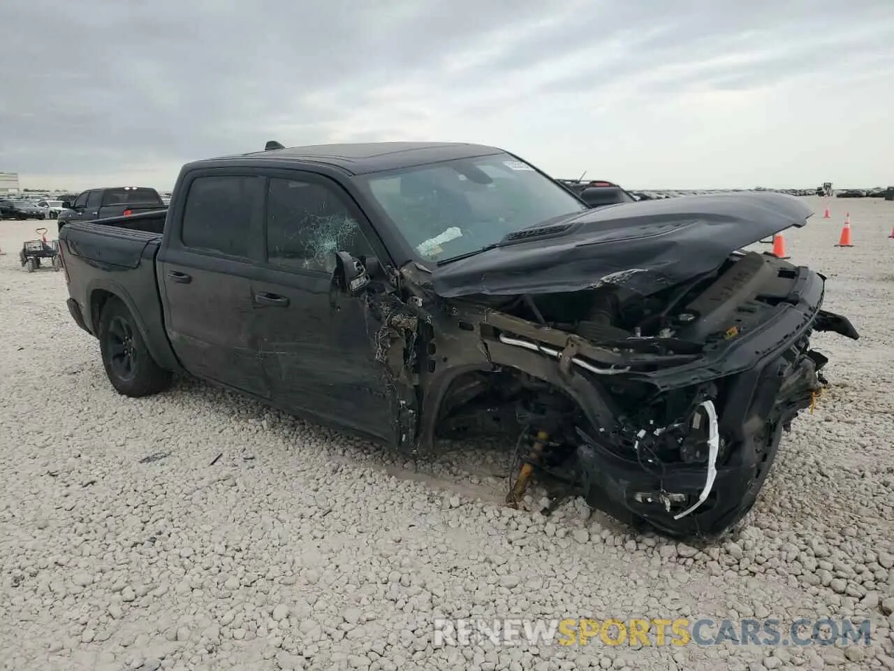 4 Photograph of a damaged car 1C6SRFLT7LN218944 RAM 1500 2020