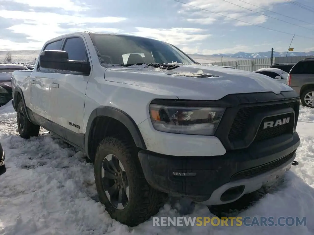 4 Photograph of a damaged car 1C6SRFLT9LN380428 RAM 1500 2020