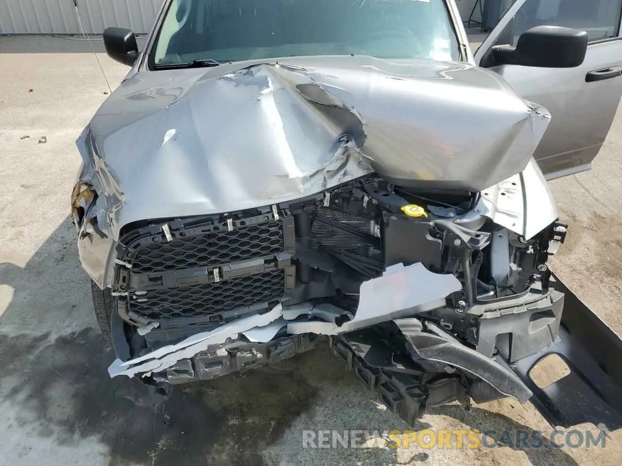 11 Photograph of a damaged car 1C6RR6FG0MS520978 RAM 1500 2021