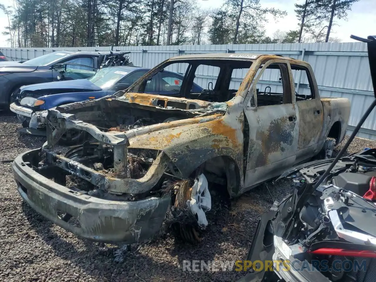 1 Photograph of a damaged car 1C6RR7LG7MS542728 RAM 1500 2021