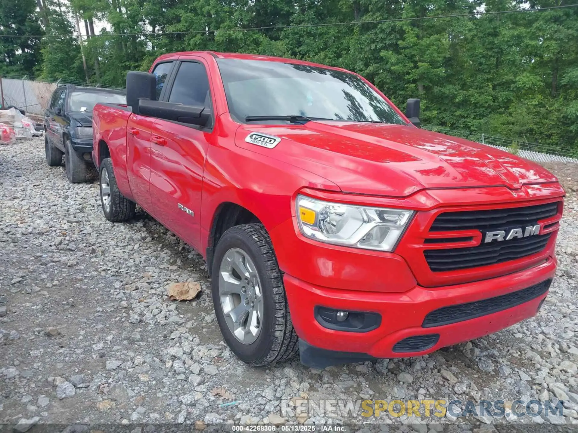 1 Photograph of a damaged car 1C6RREBT0MN828129 RAM 1500 2021