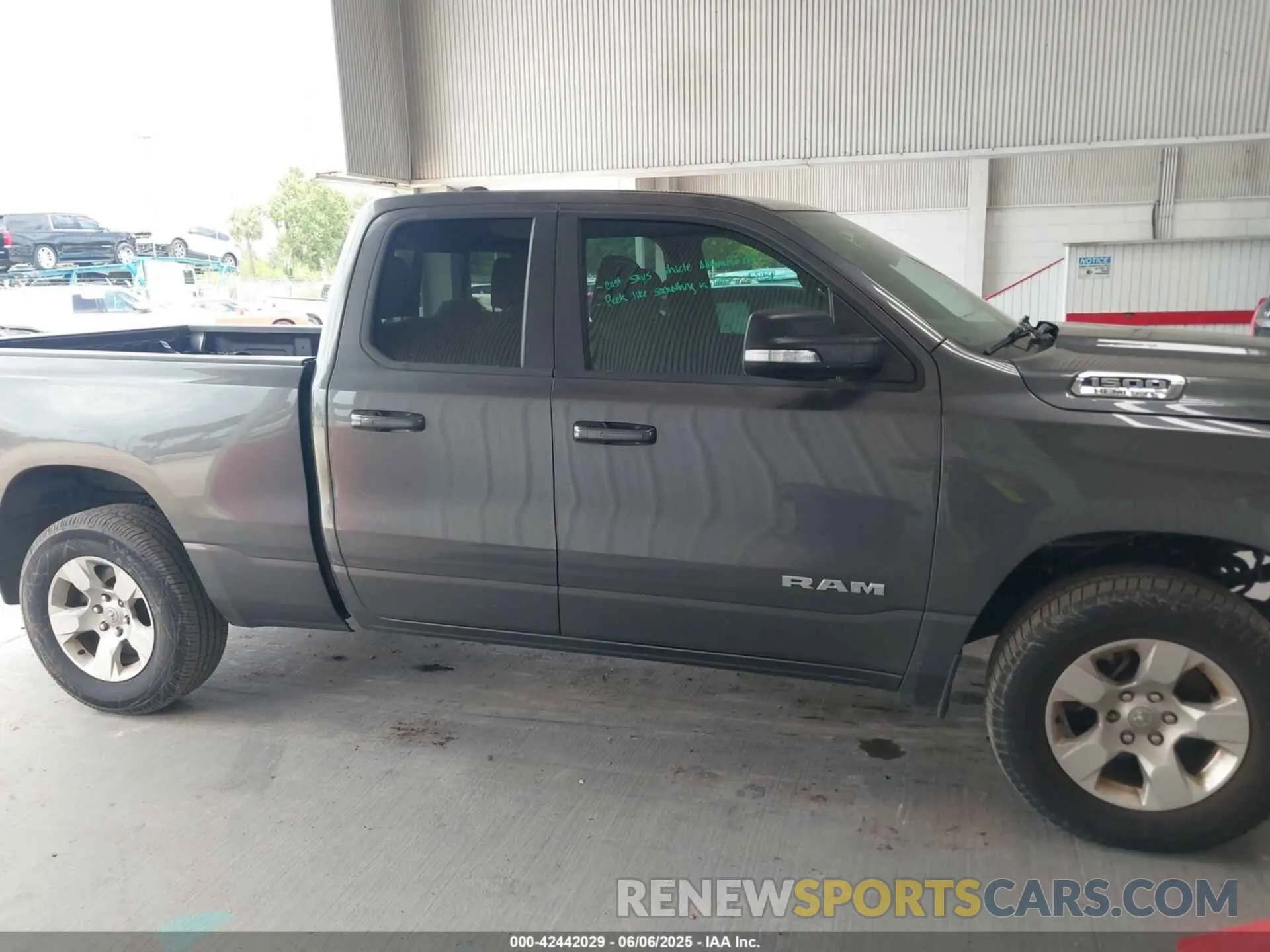 14 Photograph of a damaged car 1C6RREBT2MN747391 RAM 1500 2021