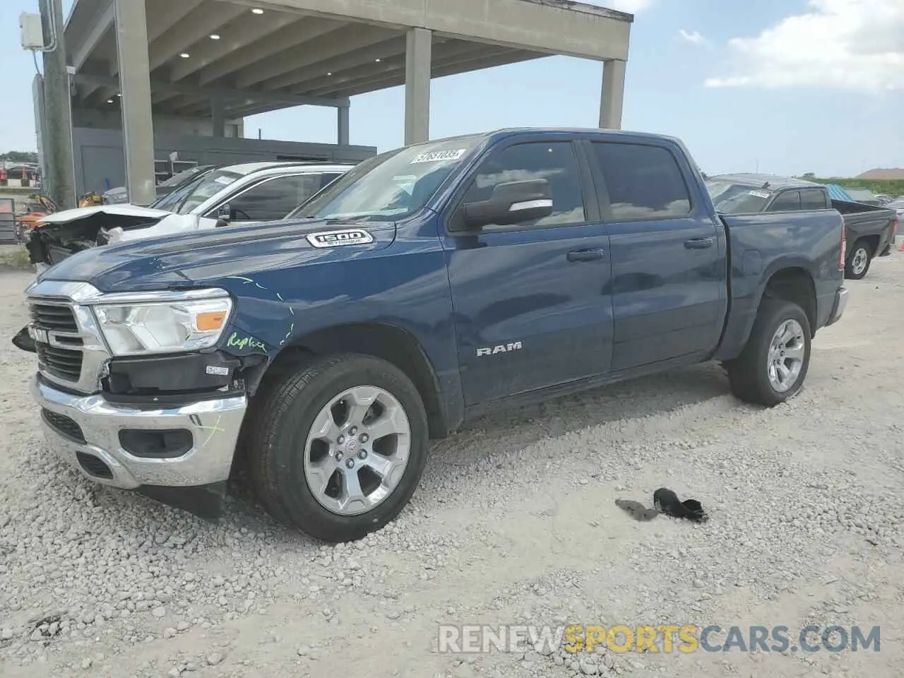1 Photograph of a damaged car 1C6RREFG5MN801831 RAM 1500 2021
